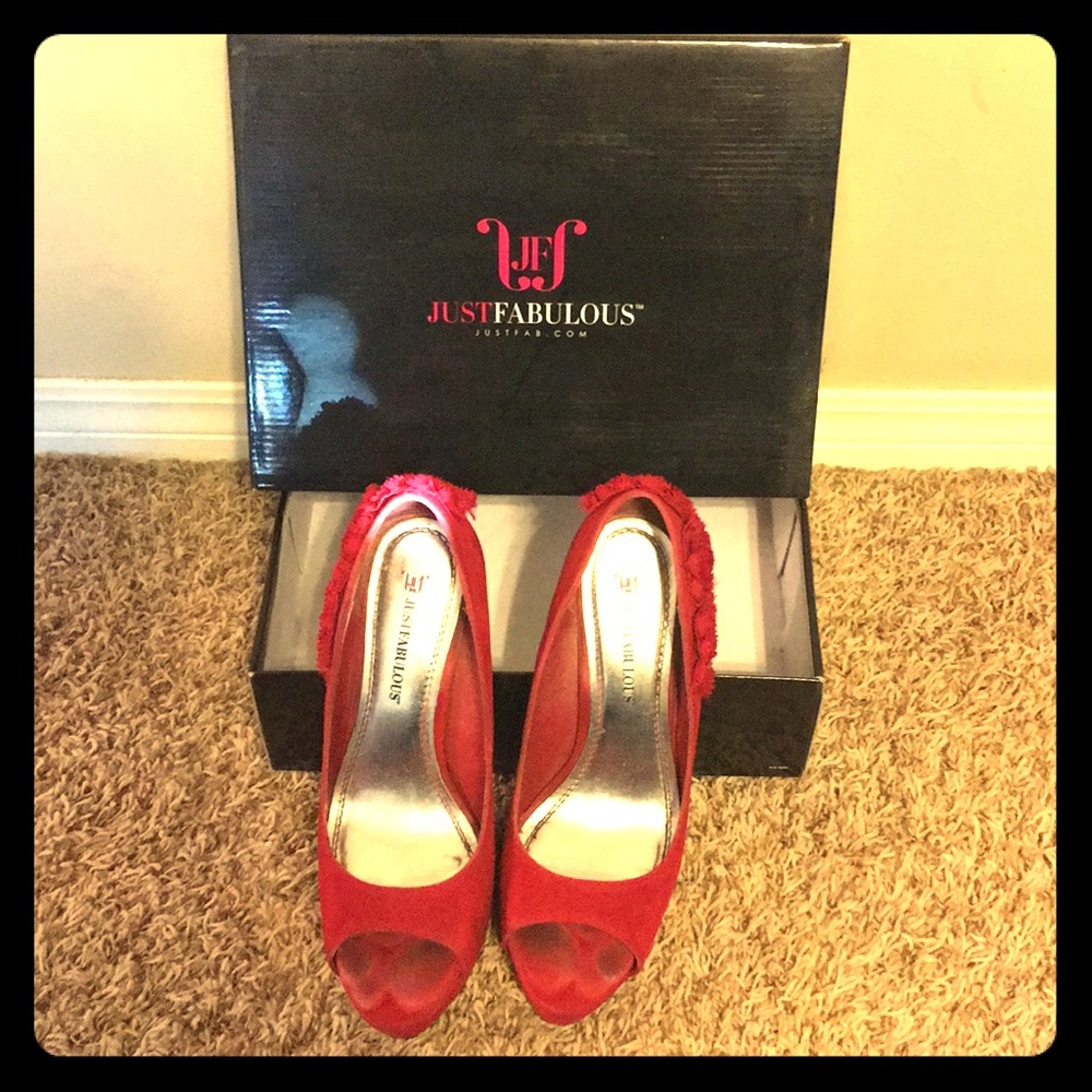 Red open toe shoes with floral detail in the back